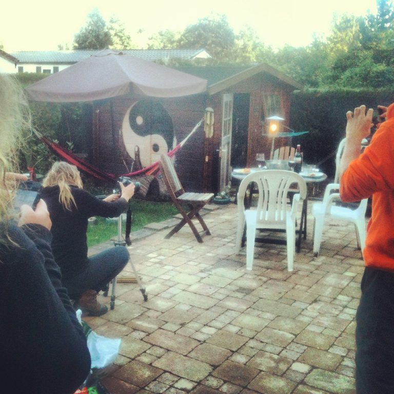 Photo of someone taking a photo of someone setting up to take a photo